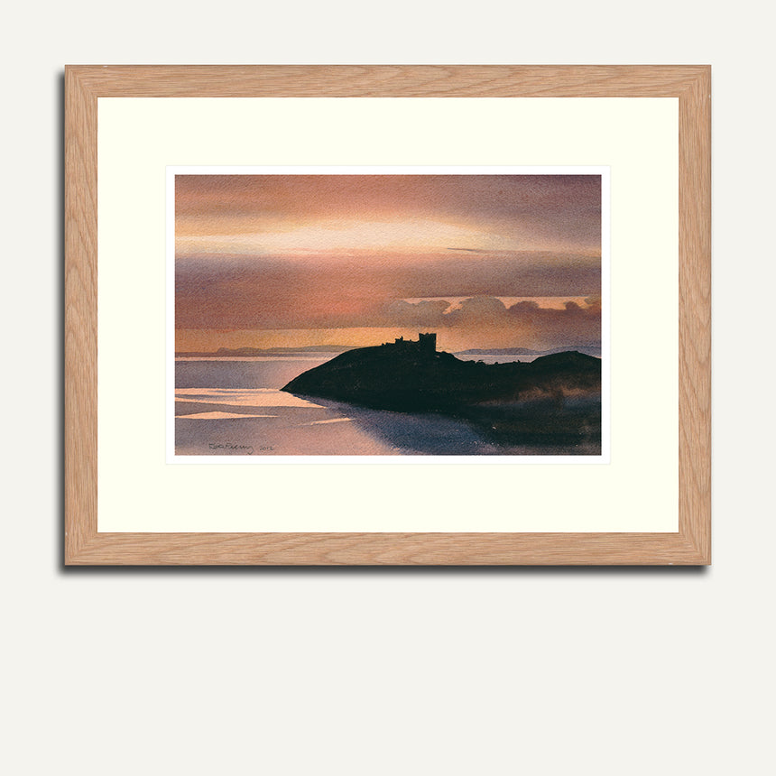 Framed Cricieth castle just before sunset.